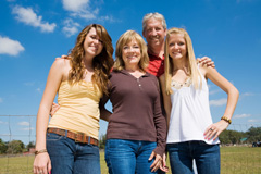 Family photo outdoors in the sun